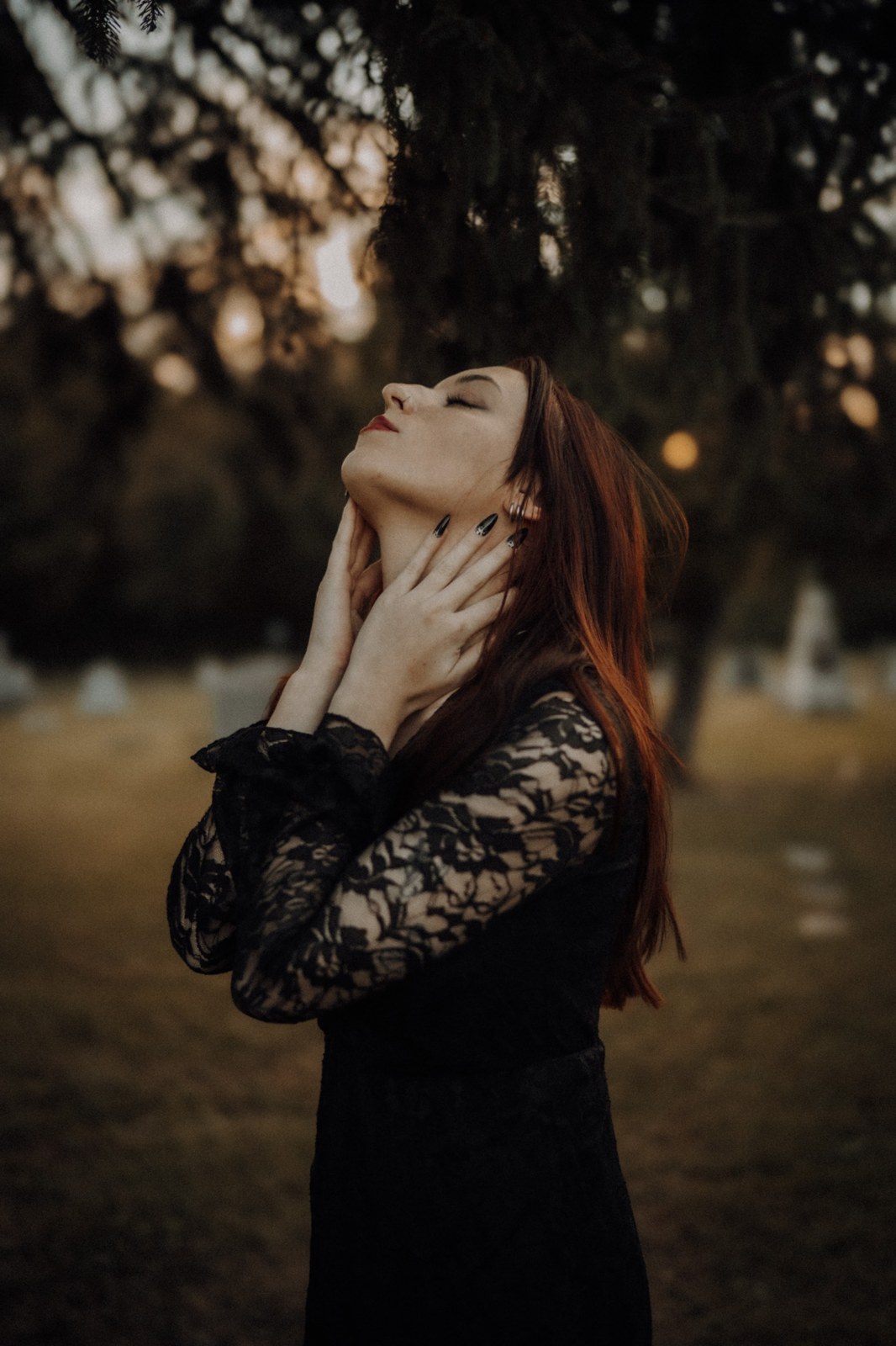 Woman in black lace looking toward the light