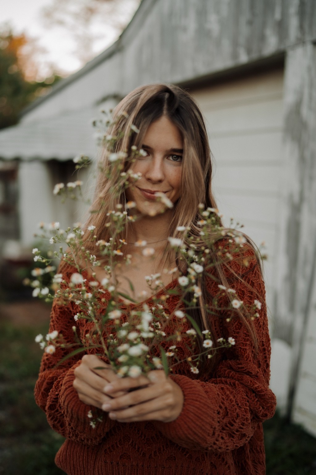 Outdoor portrait holding wildflowers